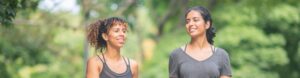 two students on a walk in the park