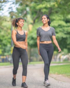 Image of students walking through a park
