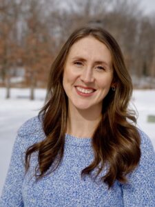Photo of Madelyn Thomas Smiling against a snowy field